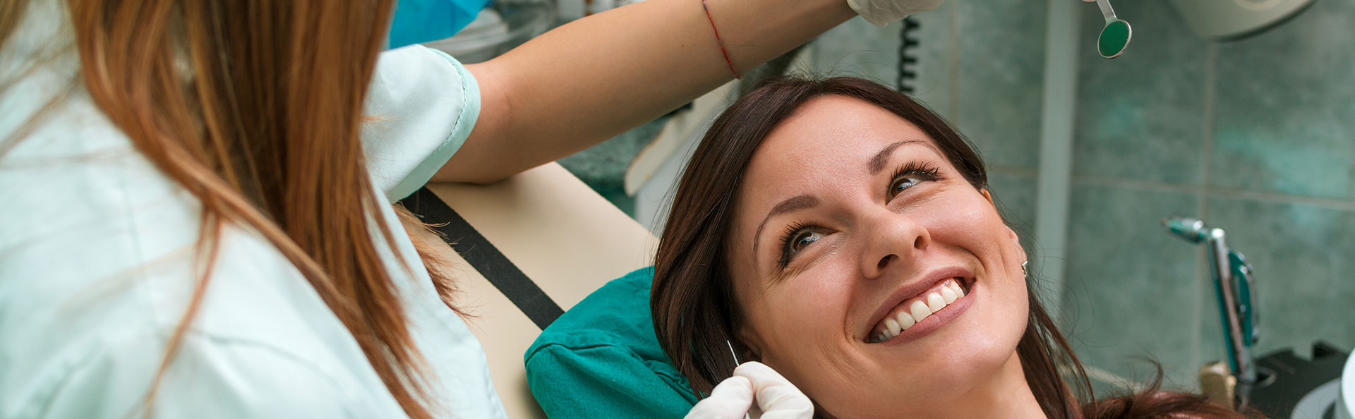 Woman smiling after dental fillings